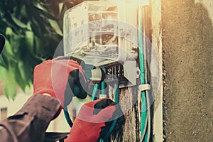 electrician installing watthour meter photo