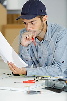 electrician looking at papers