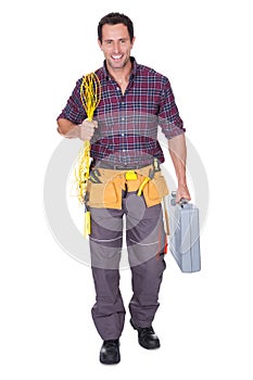 Electrician man holding cable and toolbox