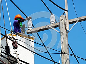 Electrician man working at height and dangerous