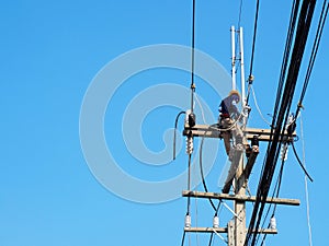 Electrician man working at height and dangerous