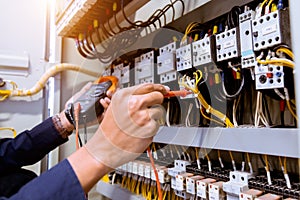 Electrician measurements with multimeter testing current electric photo