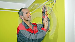 Electrician Measuring With a Digital Multimeter