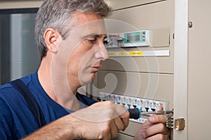 Electrician Repairing A Circuit Breaker