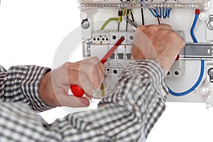 Electrician is repairing a connection