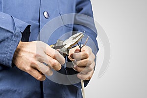 Electrician repairing an electrical cable