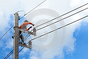 Electrician repairing wire of the power line