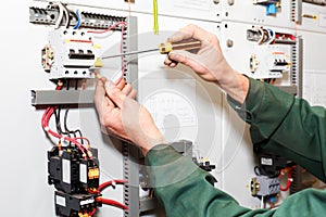 Electrician`s hands working