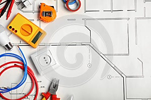 Electrician`s tools and space for text on house plan