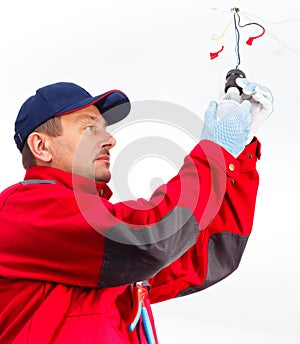 Electrician Screwing in LED Bulb