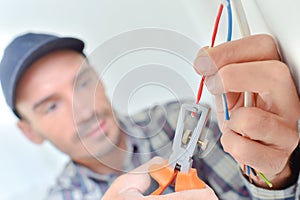 Electrician snipping a wire