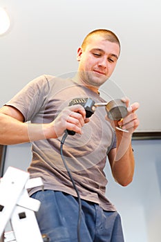 Electrician with Solder Gun photo