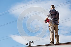 Electrician standing on rooftop