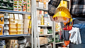 Electrician in the store of electrical components. Electricity