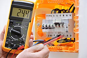 Electrician technician at work on a residential electric panel