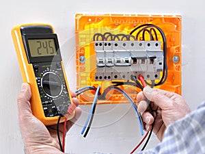 Electrician technician at work on a residential electric panel