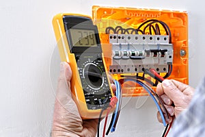 Electrician technician at work on a residential electric panel