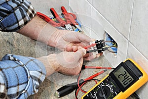 Electrician technician at work on a residential electric system.