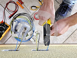 Electrician technician at work on a residential electric system