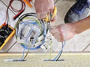 Electrician technician at work on a residential electric system