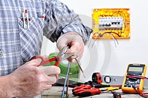 Electrician technician at work on a residential electric system