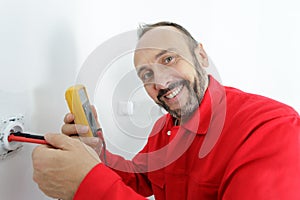 electrician technician at work on residential electrical panel