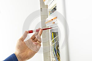 Electrician testing an electrical circuit board