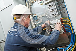 Electrician tighten the screws photo