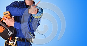 Electrician with tools and electrical equipment isolated blue detail