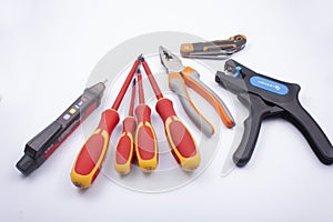 Electrician tools - voltage detector, pliers, screwdrivers, knife