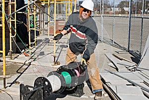 Electrician Unwinding Wire