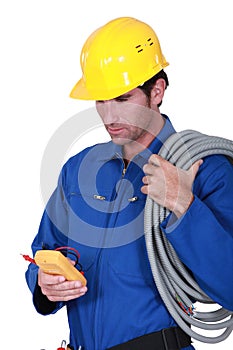 Electrician with voltmeter