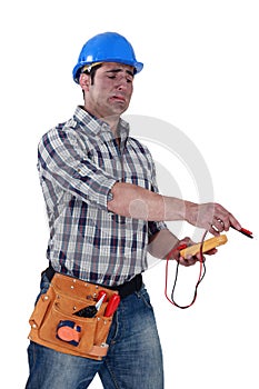 Electrician with a voltmeter