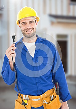 Electrician with wires cables on building site