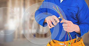 Electrician with wires cables on building site