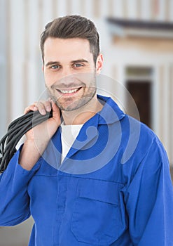 Electrician with wires cables on building site