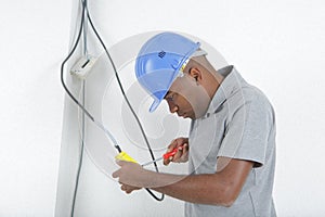 Electrician wiring up switch