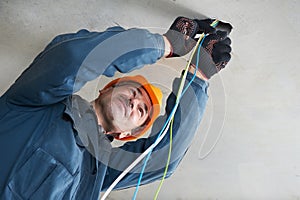 Electrician at wiring work