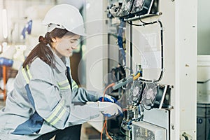 Electrician women worker checking repair maintenance fix service electric system. female electrician engineer setup testing