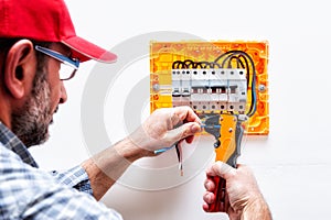 Electrician at work on an electrical panel.