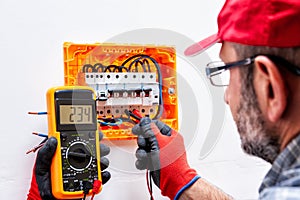 Electrician at work on an electrical panel.