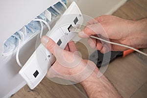 Electrician at work, home renovation, electrical installation, Hand of an electrician, handyman at work