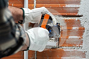 Electrician at work on a residential electrical system. Electricity