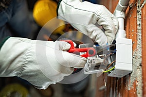 Electrician at work on a residential electrical system. Electricity