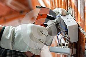 Electrician at work on a residential electrical system. Electricity