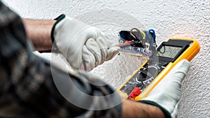 Electrician at work on a residential electrical system. Electricity