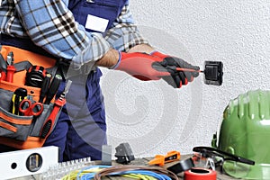 Electrician at work in safety on a residential electrical system