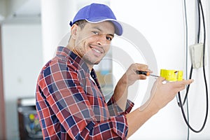 electrician worker during cabling