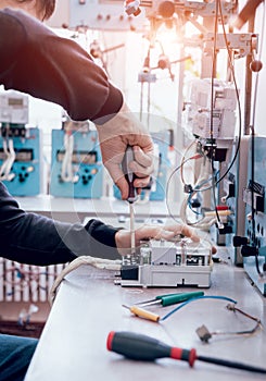 Electrician worker checking electricity meters. Electrical equipment.