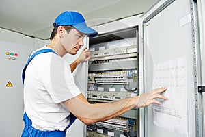 Electrician worker inspecting photo